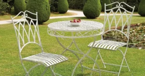 What is the Difference Between Cast Iron and Cast Aluminum - featured white metal bistro set on lawn