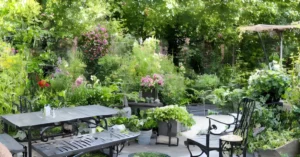 The Environmental Benefits of Cast Aluminum - green garden and cast aluminum bench featured