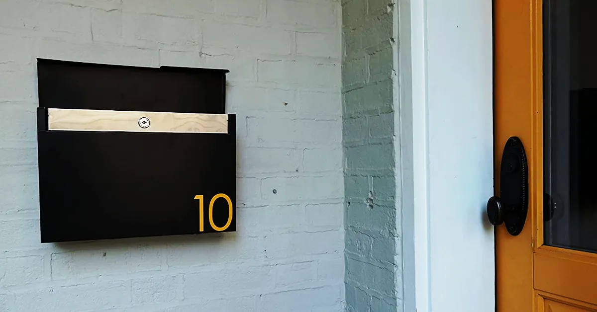black modern cast aluminum mailbox featured near a door